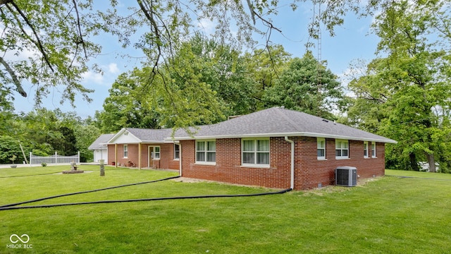 7441 State Road 60 W, Mitchell, IN 47446 - view of front of home with central AC unit, brick siding, roof with shingles, and view of scattered trees