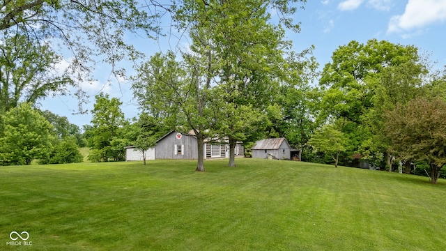 7441 State Road 60 W, Mitchell, IN 47446 - view of green lawn featuring an outbuilding and view of scattered trees
