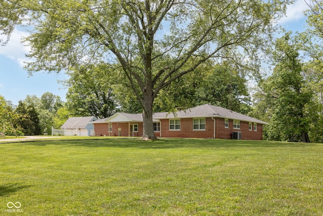 7441 State Road 60 W, Mitchell, IN 47446 - single story home featuring a front yard, cooling unit, and brick siding
