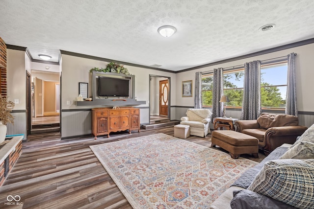 7441 State Road 60 W, Mitchell, IN 47446 - living area featuring wood finished floors, ornamental molding, a textured ceiling, and wainscoting