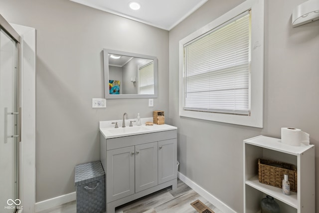 7441 State Road 60 W, Mitchell, IN 47446 - full bath with vanity, baseboards, and wood finished floors