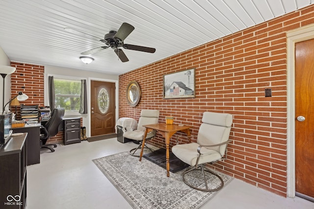 7441 State Road 60 W, Mitchell, IN 47446 - office area featuring brick wall, concrete flooring, and a ceiling fan