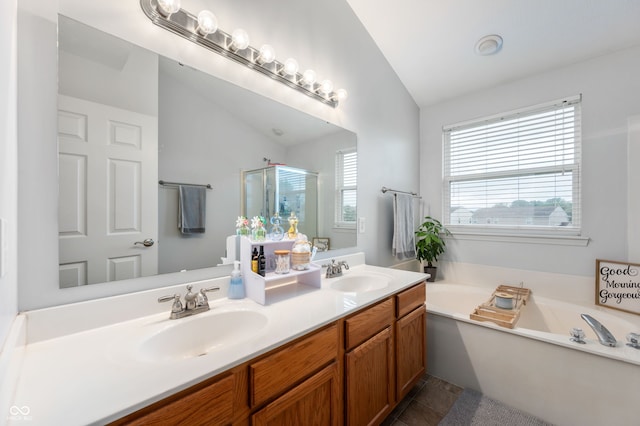 3638 Fieldstone Ln, Plainfield, IN 46168 - full bath with lofted ceiling, a garden tub, a stall shower, double vanity, and tile patterned floors