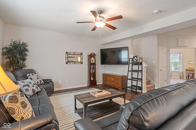 918 Cass Dr, Franklin, IN 46131 - living room featuring a ceiling fan, stairs, baseboards, and wood finished floors