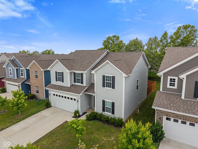 918 Cass Dr, Franklin, IN 46131 - traditional home featuring driveway, a garage, a front yard, and roof with shingles