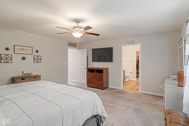 918 Cass Dr, Franklin, IN 46131 - bedroom with light colored carpet, baseboards, ceiling fan, and connected bathroom