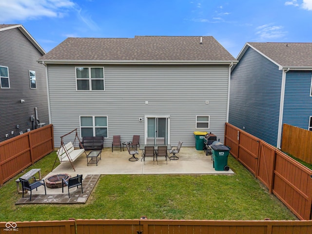 918 Cass Dr, Franklin, IN 46131 - back of property with an outdoor fire pit, a patio area, and roof with shingles