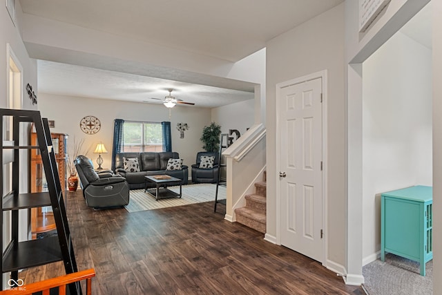 918 Cass Dr, Franklin, IN 46131 - living room featuring a ceiling fan, dark wood finished floors, stairway, and baseboards