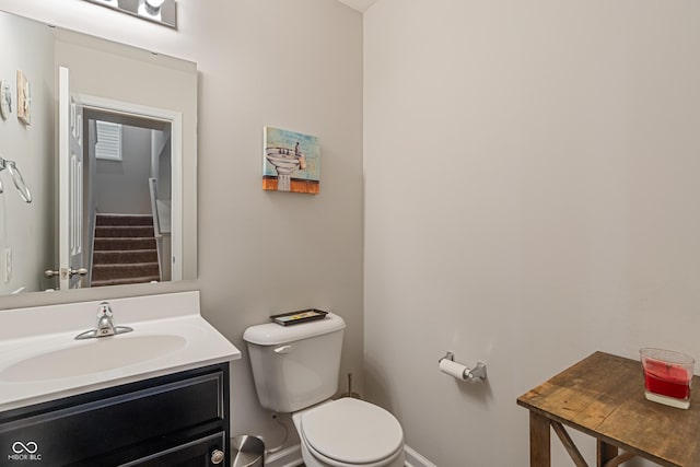 918 Cass Dr, Franklin, IN 46131 - half bathroom featuring toilet, vanity, and baseboards