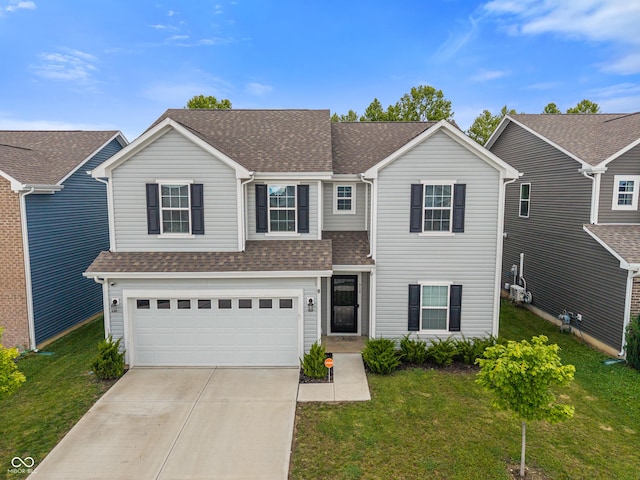 918 Cass Dr, Franklin, IN 46131 - traditional-style house with roof with shingles, driveway, a garage, and a front lawn