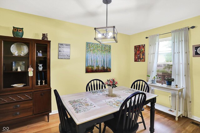 2623 Senators Way, Indianapolis, IN 46217 - dining room featuring light wood-style floors and baseboards