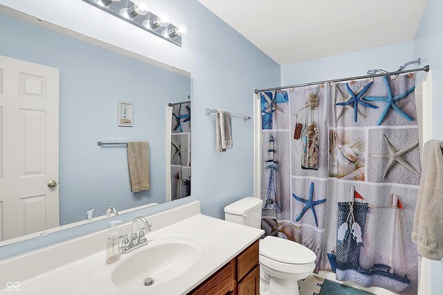 2623 Senators Way, Indianapolis, IN 46217 - bathroom with toilet, vanity, and a shower with curtain