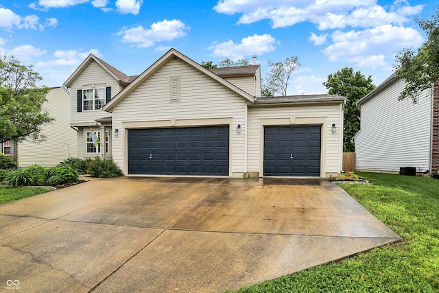 2623 Senators Way, Indianapolis, IN 46217 - traditional-style house featuring an attached garage, concrete driveway, and a front yard