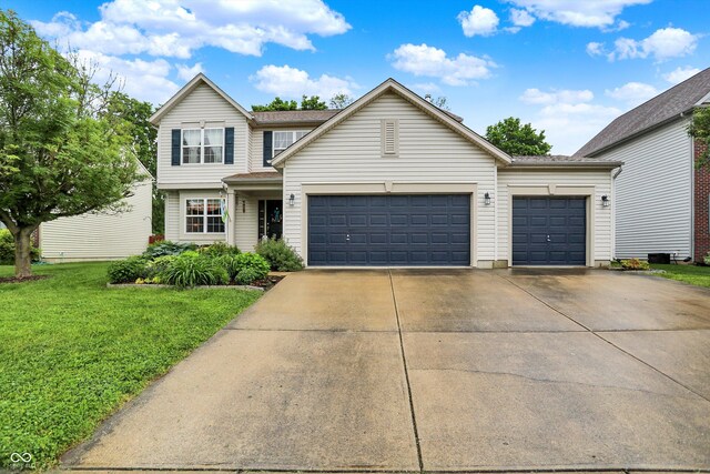 2623 Senators Way, Indianapolis, IN 46217 - traditional-style home featuring driveway, a front lawn, and a garage