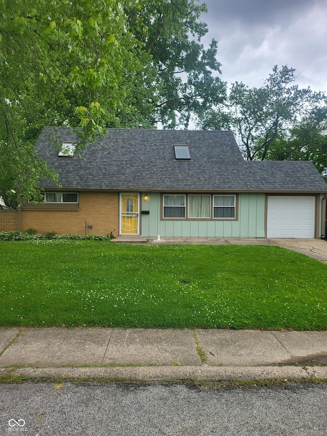 6117 Marilyn Rd, Indianapolis, IN 46226 - view of front of house featuring a front yard, an attached garage, roof with shingles, and board and batten siding