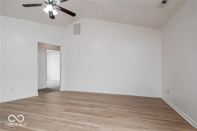 6707 Dovir Woods Dr, Sellersburg, IN 47172 - spare room featuring vaulted ceiling, ceiling fan, wood finished floors, and baseboards