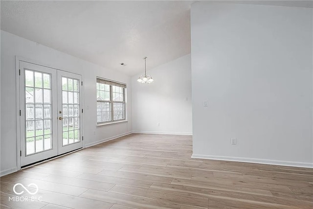 6707 Dovir Woods Dr, Sellersburg, IN 47172 - unfurnished room featuring a chandelier, light wood-type flooring, french doors, lofted ceiling, and baseboards