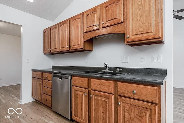 6707 Dovir Woods Dr, Sellersburg, IN 47172 - kitchen with stainless steel dishwasher, a sink, light wood finished floors, dark countertops, and lofted ceiling