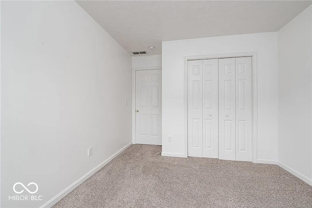 6707 Dovir Woods Dr, Sellersburg, IN 47172 - unfurnished bedroom with carpet floors, baseboards, a closet, and a textured ceiling