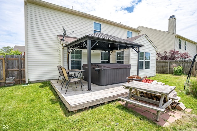 2730 Foxbriar Pl, Indianapolis, IN 46203 - rear view of house featuring a hot tub, a gazebo, and a deck