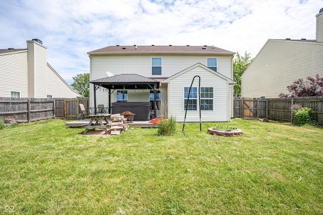 2730 Foxbriar Pl, Indianapolis, IN 46203 - rear view of property featuring a hot tub, a gazebo, and a patio