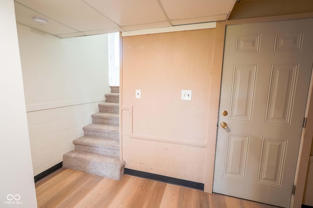 2721 W 34th St, Anderson, IN 46011 - stairs featuring a paneled ceiling and wood finished floors