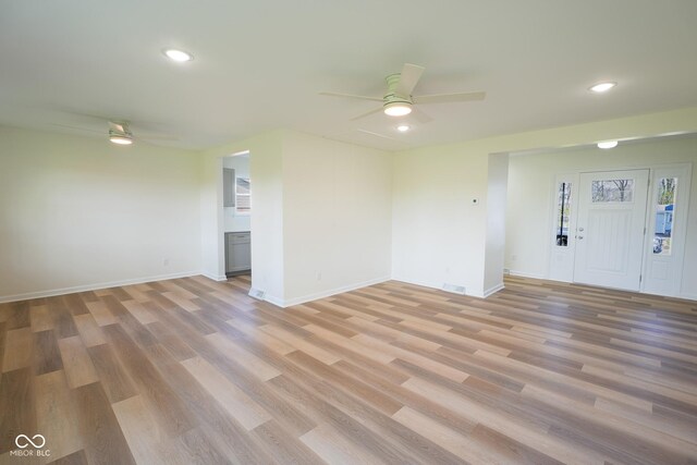 2721 W 34th St, Anderson, IN 46011 - unfurnished living room with ceiling fan, light wood-style floors, baseboards, and recessed lighting