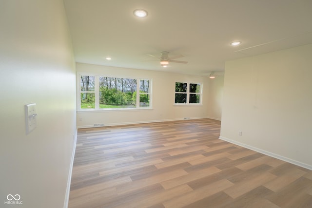 2721 W 34th St, Anderson, IN 46011 - spare room featuring ceiling fan, recessed lighting, light wood finished floors, and baseboards