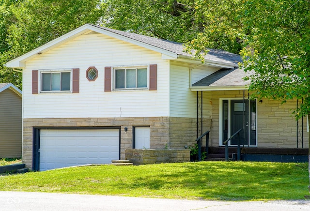 2721 W 34th St, Anderson, IN 46011 - tri-level home featuring stone siding, an attached garage, a shingled roof, and a front lawn