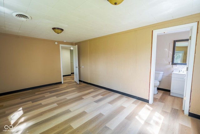 2721 W 34th St, Anderson, IN 46011 - spare room featuring light wood-style floors and baseboards