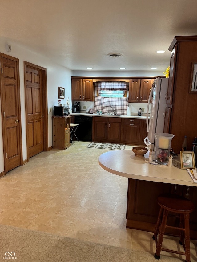 1711 Lafayette Ave Unit 7, Lebanon, IN 46052 - kitchen with freestanding refrigerator, dishwasher, light countertops, a peninsula, and recessed lighting