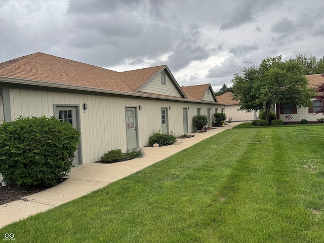 1711 Lafayette Ave Unit 7, Lebanon, IN 46052 - back of house with a yard and a shingled roof