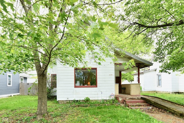 1106 W 4th St, Anderson, IN 46016 - view of front facade with a porch