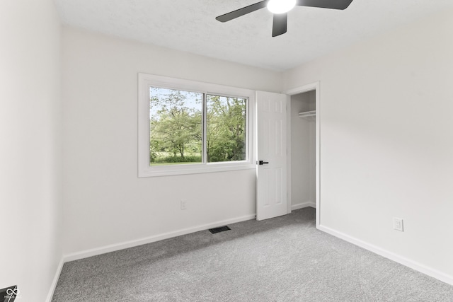 8933 W 1050 S, Fortville, IN 46040 - unfurnished bedroom with carpet floors, baseboards, and a ceiling fan