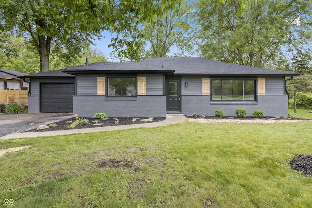 8933 W 1050 S, Fortville, IN 46040 - view of front of house featuring brick siding, driveway, a garage, and a front yard