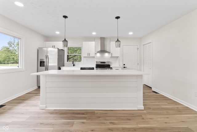 8933 W 1050 S, Fortville, IN 46040 - kitchen with wall chimney range hood, stainless steel appliances, light countertops, white cabinetry, and recessed lighting