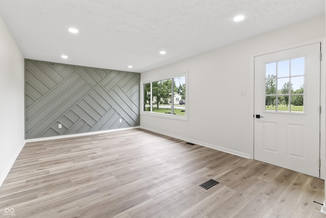 8933 W 1050 S, Fortville, IN 46040 - foyer entrance featuring light wood finished floors, recessed lighting, and baseboards