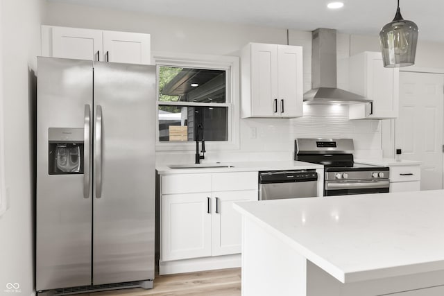 8933 W 1050 S, Fortville, IN 46040 - kitchen with stainless steel appliances, wall chimney range hood, a sink, and white cabinets
