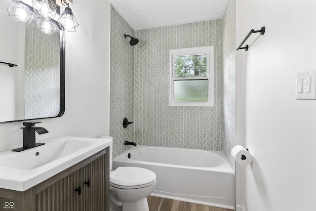 8933 W 1050 S, Fortville, IN 46040 - full bathroom with wood finished floors, vanity, toilet, and bathtub / shower combination
