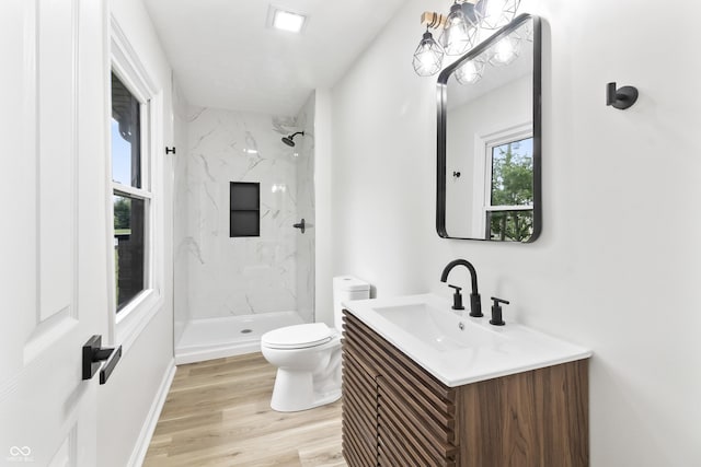 8933 W 1050 S, Fortville, IN 46040 - bathroom featuring toilet, vanity, a marble finish shower, and wood finished floors