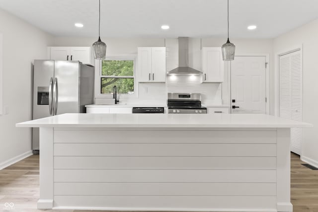 8933 W 1050 S, Fortville, IN 46040 - kitchen featuring appliances with stainless steel finishes, wall chimney exhaust hood, white cabinets, light countertops, and recessed lighting