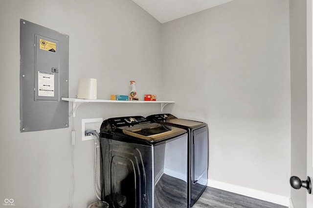 158 Handley St, Indianapolis, IN 46222 - laundry area with washing machine and dryer, electric panel, wood finished floors, and baseboards