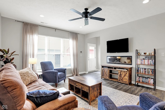 158 Handley St, Indianapolis, IN 46222 - living area with recessed lighting, ceiling fan, wood finished floors, baseboards, and a textured ceiling