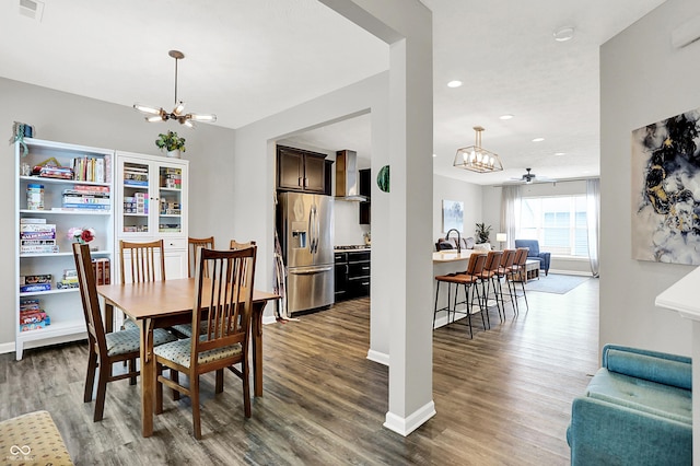 158 Handley St, Indianapolis, IN 46222 - dining space featuring a chandelier, wood finished floors, recessed lighting, baseboards, and a ceiling fan