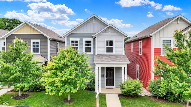158 Handley St, Indianapolis, IN 46222 - view of front of house featuring board and batten siding, a front yard, and roof with shingles