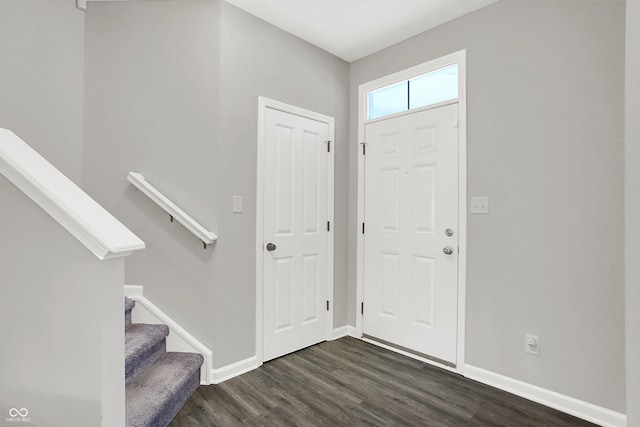 158 Handley St, Indianapolis, IN 46222 - foyer featuring dark wood-style flooring, baseboards, and stairway