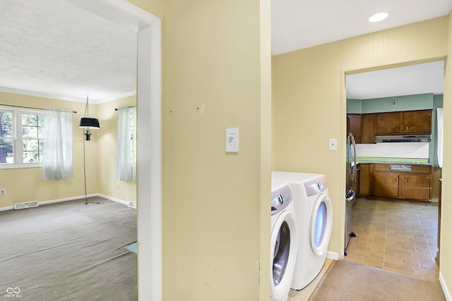 3215 E Edgewood Ave, Indianapolis, IN 46227 - washroom featuring independent washer and dryer, baseboards, brick patterned flooring, crown molding, and light colored carpet