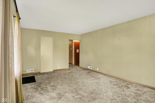 3215 E Edgewood Ave, Indianapolis, IN 46227 - empty room with carpet flooring and baseboards