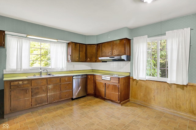 3215 E Edgewood Ave, Indianapolis, IN 46227 - kitchen with dishwasher, a sink, light countertops, under cabinet range hood, and decorative backsplash