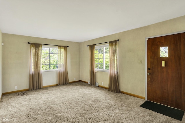 3215 E Edgewood Ave, Indianapolis, IN 46227 - entryway featuring plenty of natural light, baseboards, and carpet
